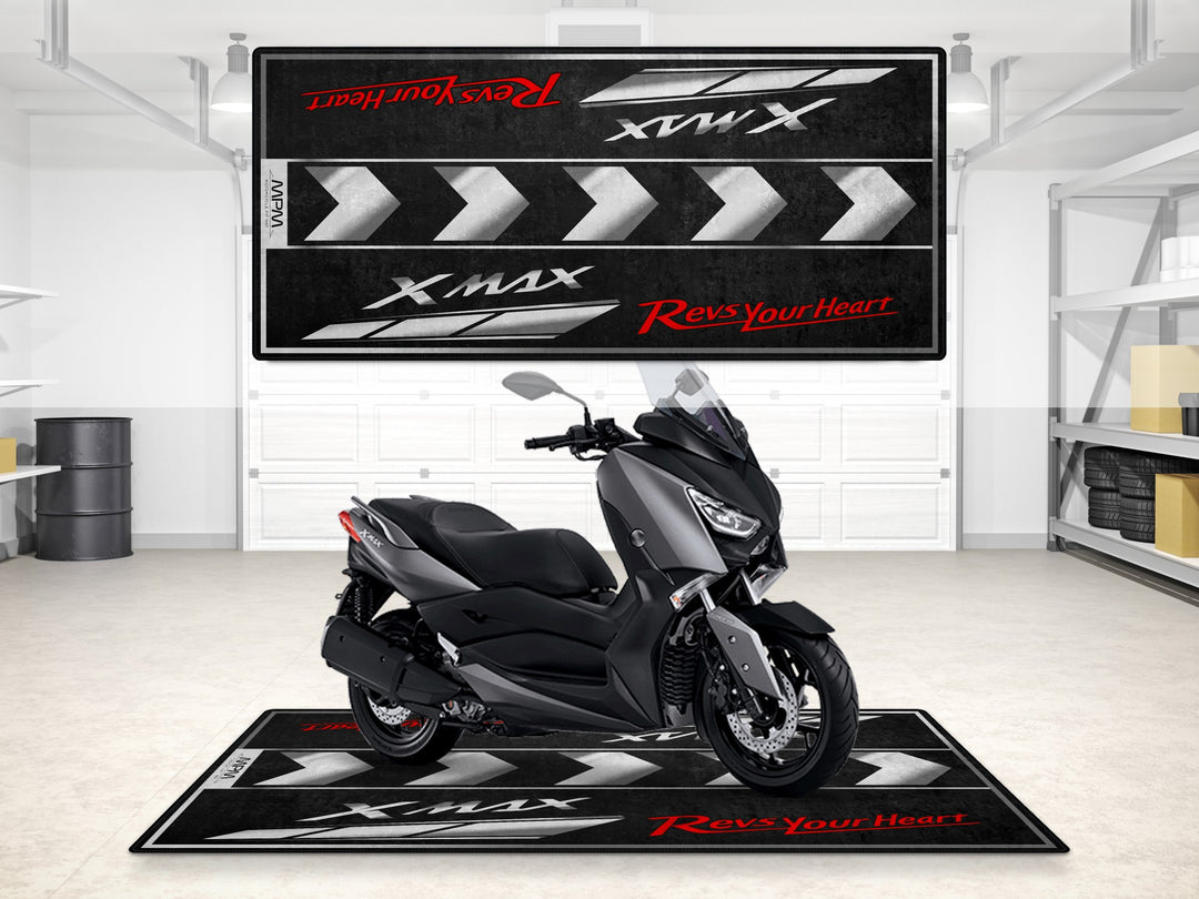 Yamaha XMAX 300 on a garage mat with Revs Your Heart design. A must-have pit mat and showroom accessory for city riders.