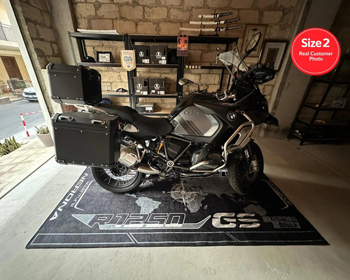 BMW R1250 GS Black White Blue Motorcycle Garage Mat in adventure bike zone showroom setting