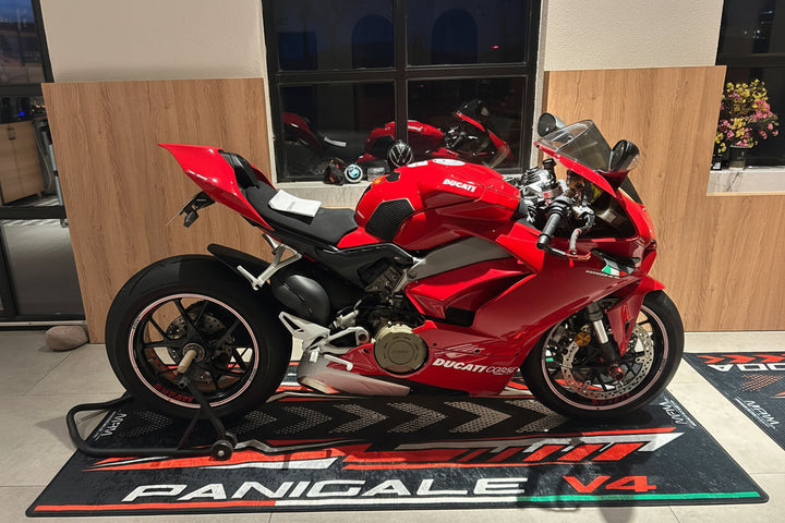 Ducati Panigale V4 garage pit mat in motorcycle expo setup, durable non-slip floor rug for performance display.