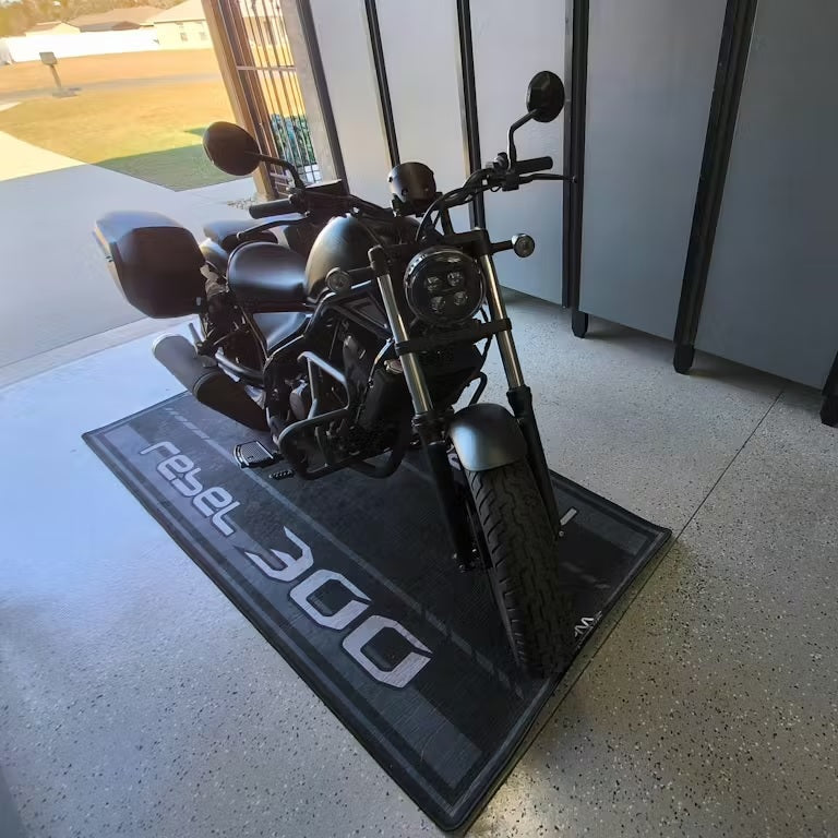 Honda Rebel 300 garage pit mat for cruiser bikes, non-slip motorcycle floor cover in real outdoor home environment.