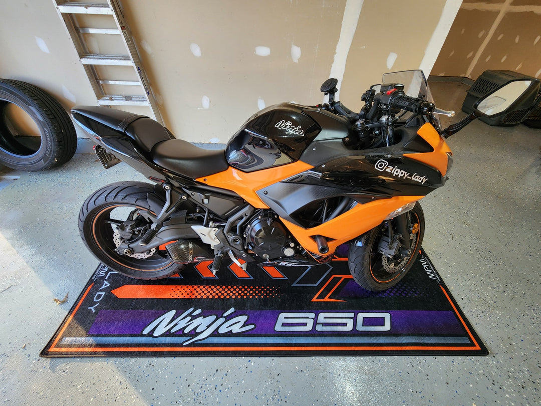 Kawasaki Ninja 650 Black Motorcycle Garage Mat in indoor bike zone showroom setting