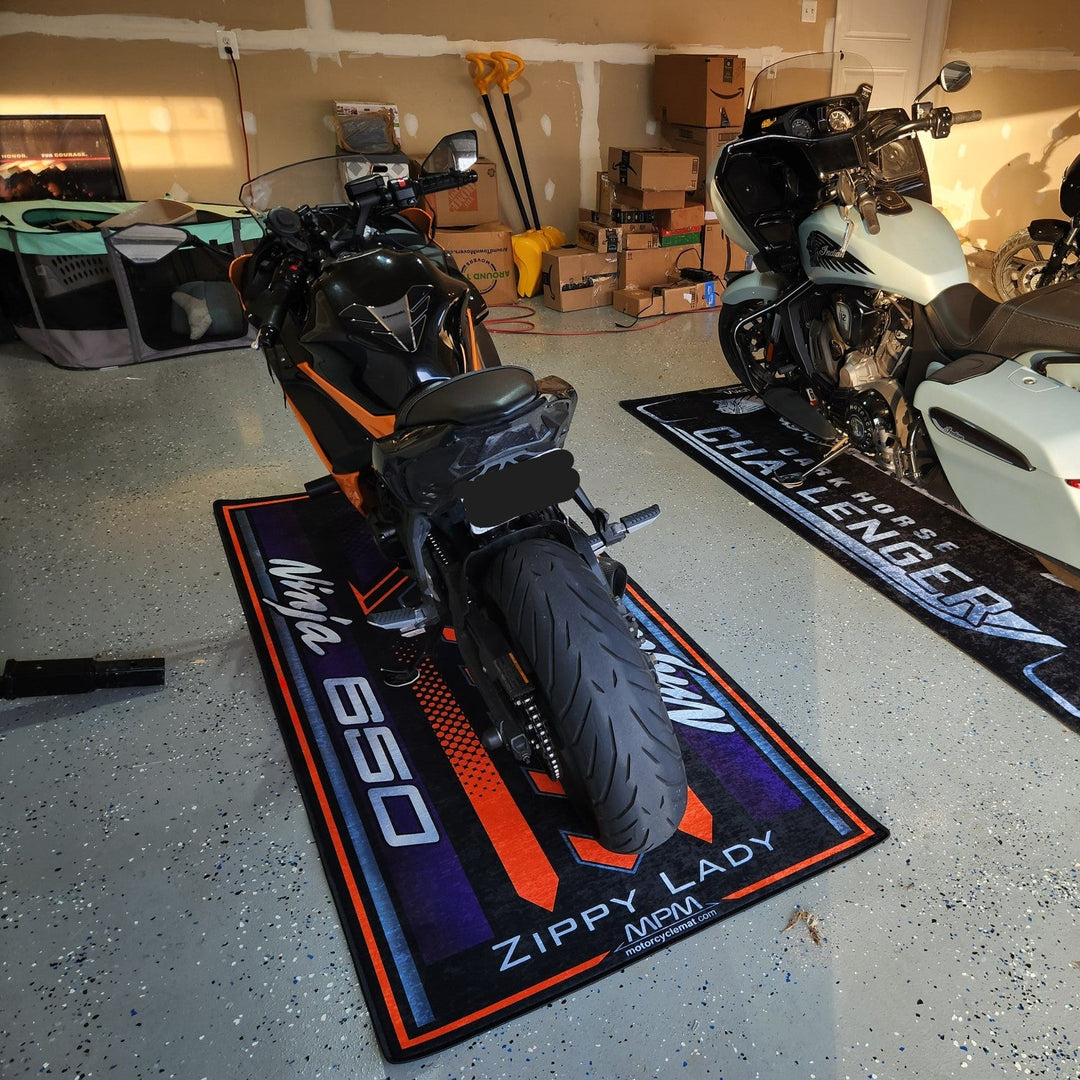 Kawasaki Ninja 650 Black Motorcycle Garage Mat displayed in real garage on MPM floor cover