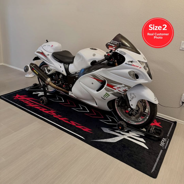 Suzuki Hayabusa motorcycle display on non-slip garage pit mat, indoor superbike storage and showcase solution.