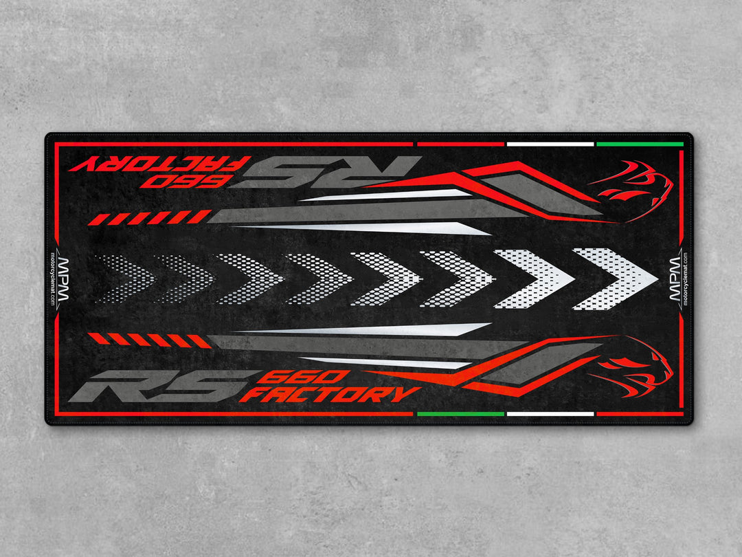 Aprilia RS 660 Factory Dark Banshee garage mat. Heavy-duty parking mat and parts-friendly floor cover for riders who value protection and display.

