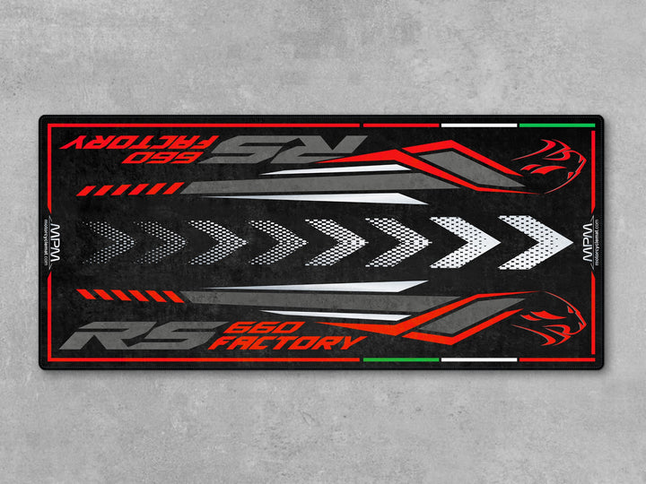 Aprilia RS 660 Factory Dark Banshee garage mat. Heavy-duty parking mat and parts-friendly floor cover for riders who value protection and display.
