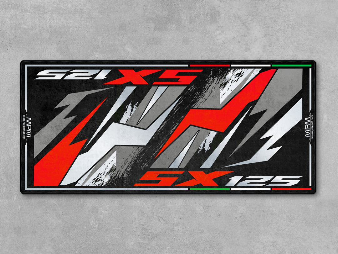 Aprilia SX 125 Varanus Black motorcycle rug. Heavy-duty garage carpet and parking mat for dirt or street riders who want parts protection and style.
