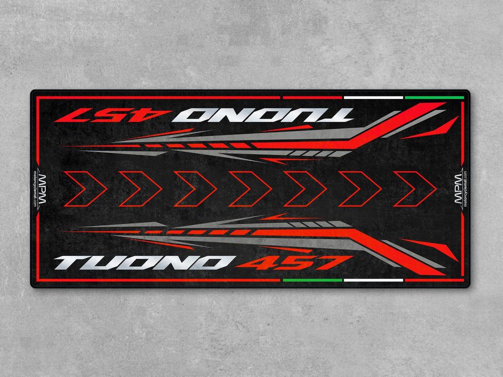 Aprilia Tuono 457 Piranha Red garage mat. Durable parking pad and garage floor mat made for riders looking to protect and display their bike in style.
