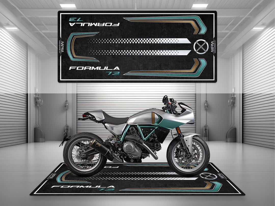 MPM Ducati Formula 73 motorcycle displayed on premium garage mat in modern showroom