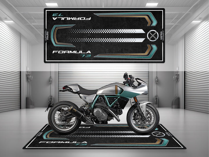 MPM Ducati Formula 73 motorcycle displayed on premium garage mat in modern showroom