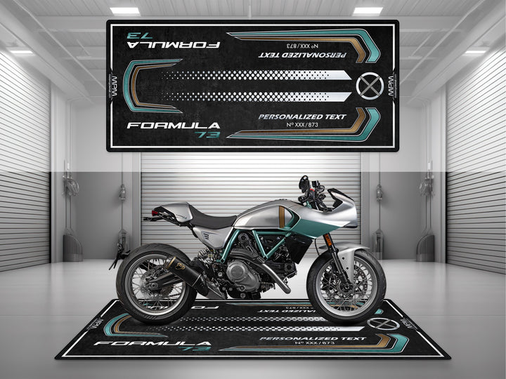 Ducati Formula 73 showroom setup on MPM motorcycle pit mat with modern graphic layout