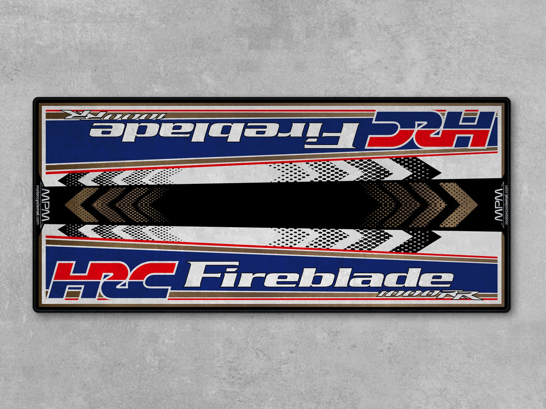 Honda 1000RR-R Fireblade Red White Blue Motorcycle Garage Mat in racetrack track prep setting