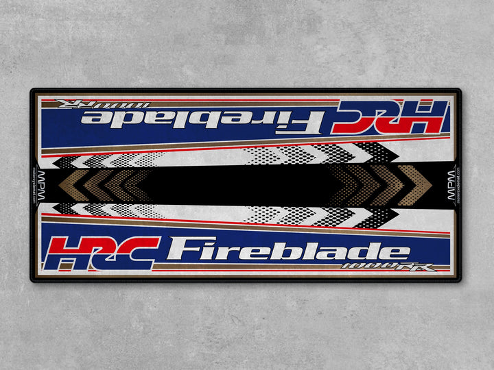 Honda 1000RR-R Fireblade Red White Blue Motorcycle Garage Mat in racetrack track prep setting
