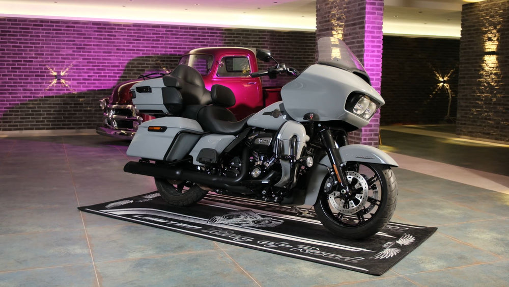 Custom parking and display mats for Harley-Davidson models like Road Glide, Street Glide, Fat Boy, Softail, and Sportster. Non-slip, garage-ready protection.